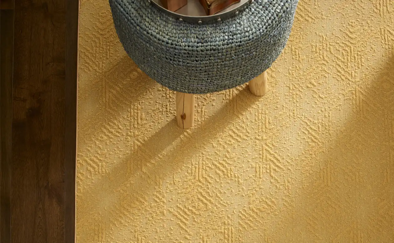 Closeup of pale yellow, textured area rug